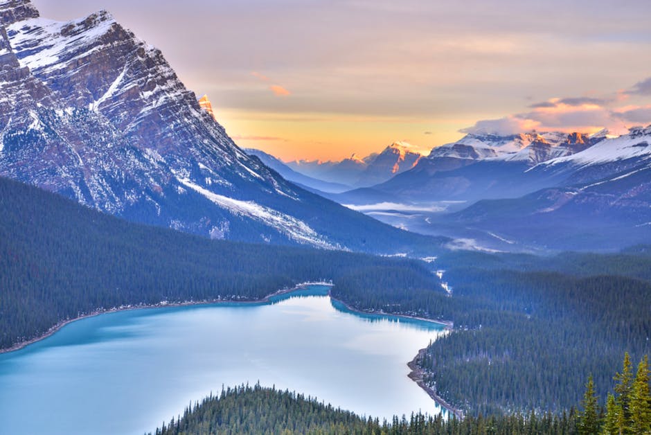 Breathtaking sunrise view of Peyto Lake and the Canadian Rockies in Banff National Park, Alberta.