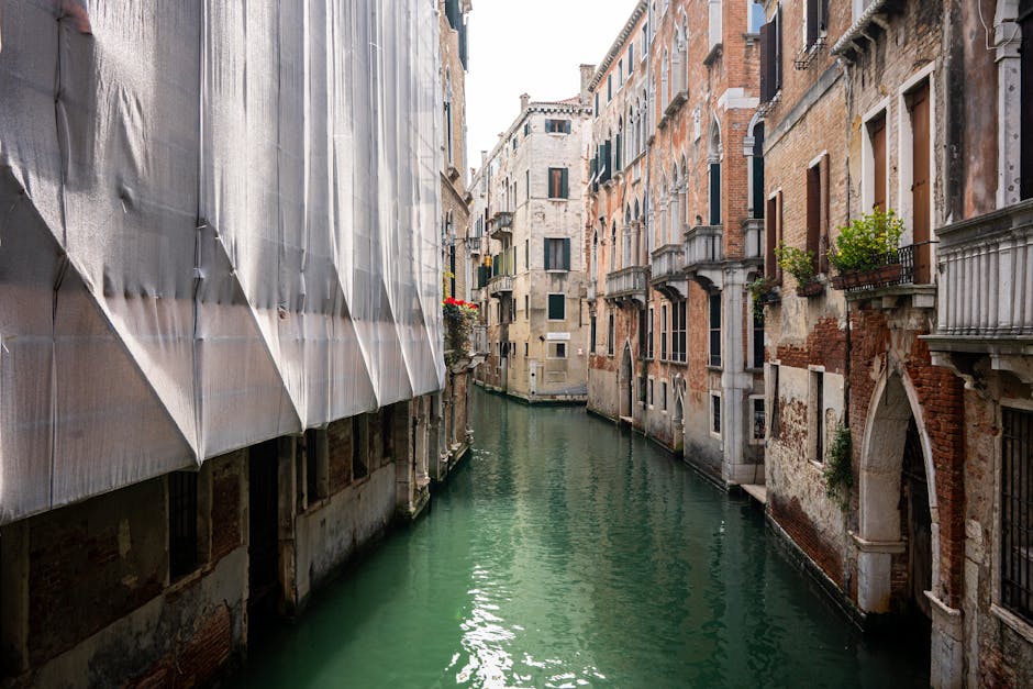 Explore the scenic charm of Venice's historic canals lined with classic architecture.