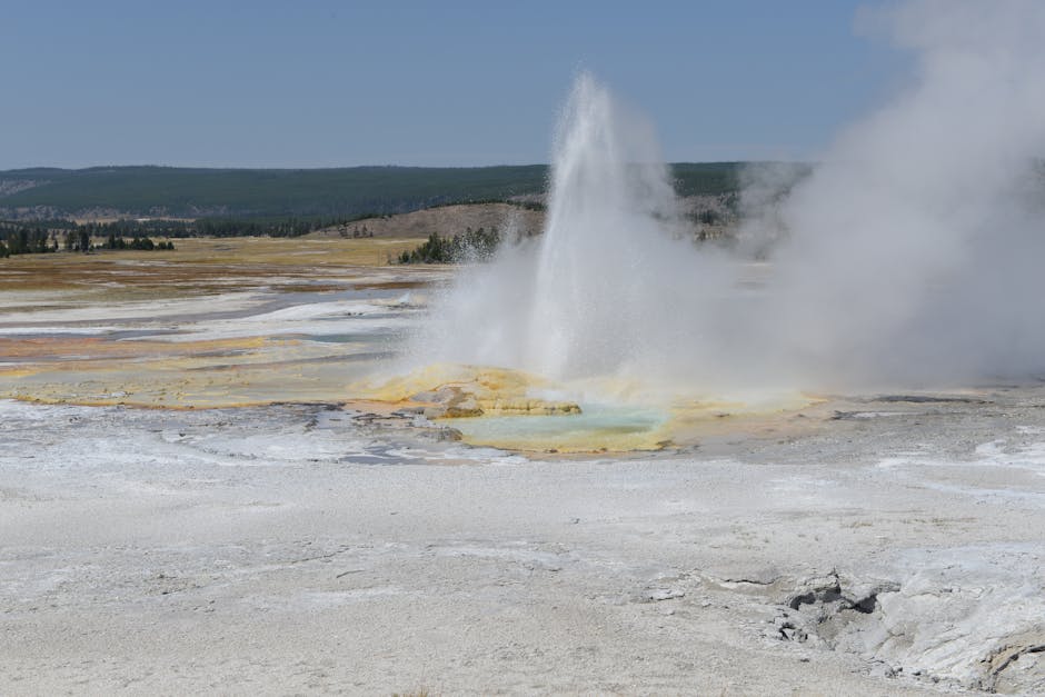 A breathtaking view of a geyser erupting in Yellowstone National Park, USA.