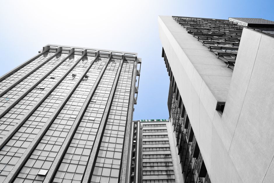 Low-angle view of modern skyscrapers in Lagos, showcasing urban architecture against a clear sky.