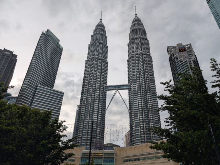 Stunning view of the Petronas Twin Towers in Kuala Lumpur, Malaysia. Iconic modern architecture.