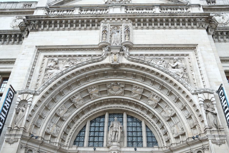 Close-up view of an ornate architectural arch adorned with intricate sculptures and reliefs.