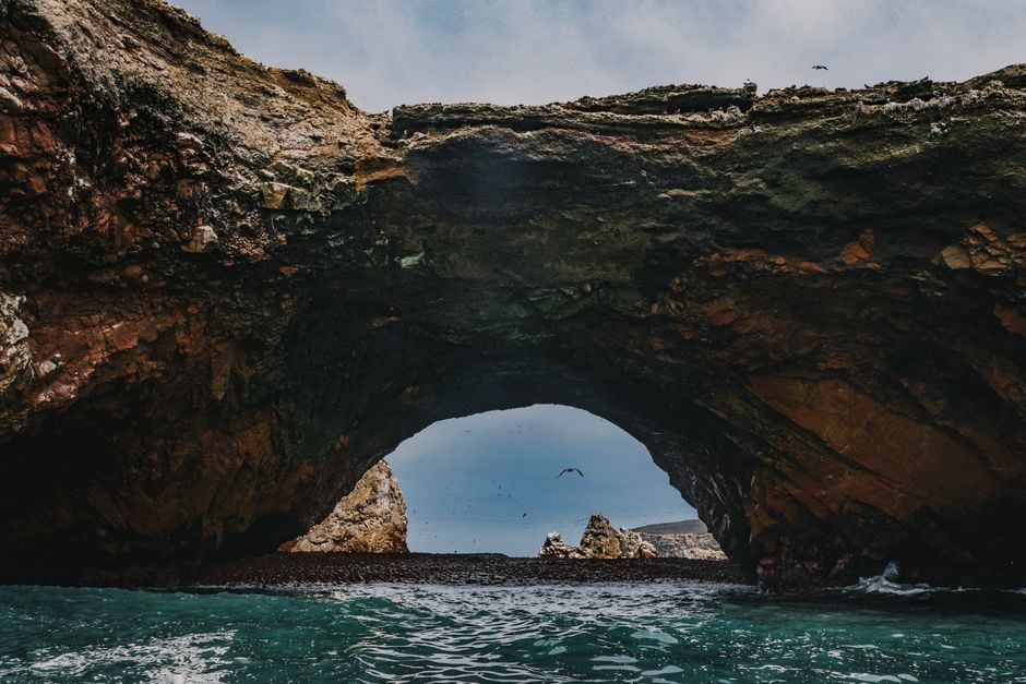 Explore the stunning natural rock arch in the coastal Ballestas Islands, Paracas, Peru.