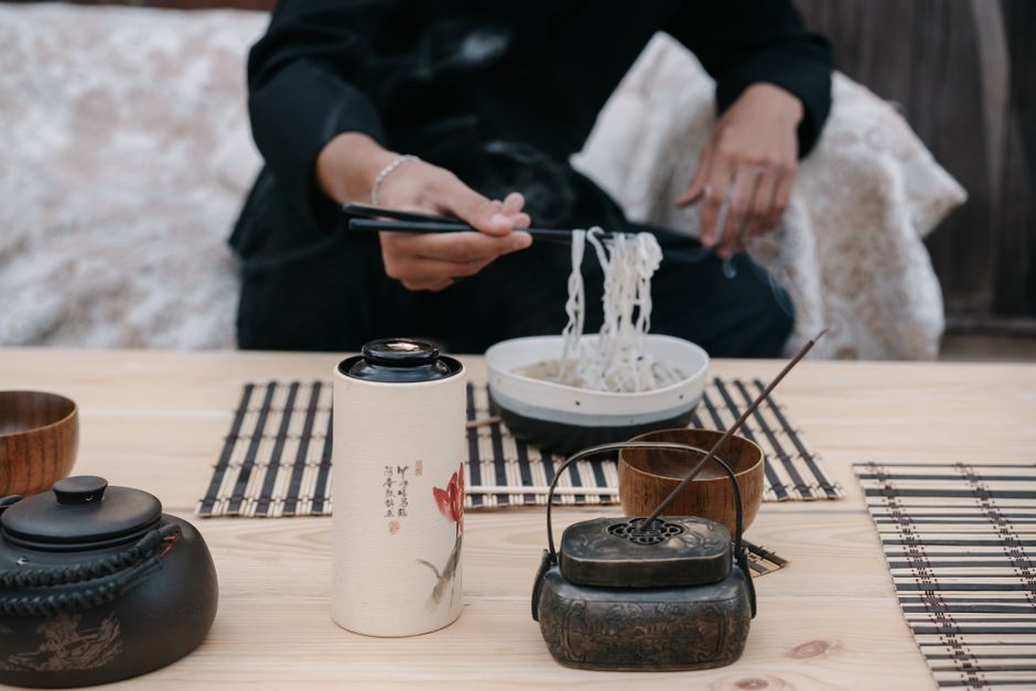 Authentic Japanese dining setup with focus on noodles and traditional utensils.