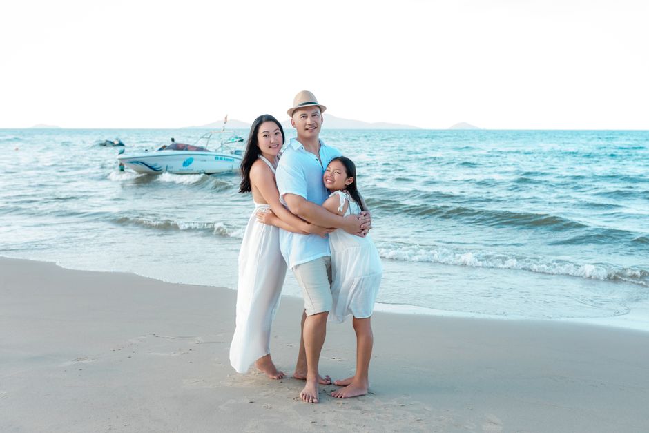 Happy family bonding on the beach in Hội An, enjoying the summer sun and sea.